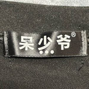 Black short sleeve shirt with back design shown in pictures .